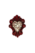 Decorative heart-shaped object with intricate red border on a white background