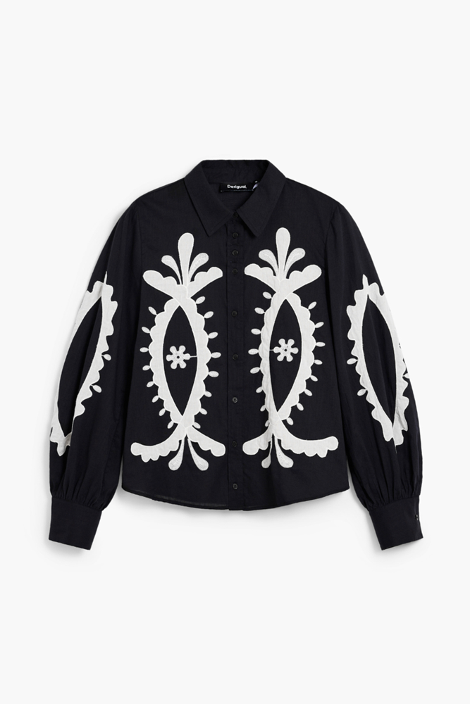 Black shirt with white abstract patterns on a white background