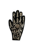 Decorative black glove with metallic designs on a white background