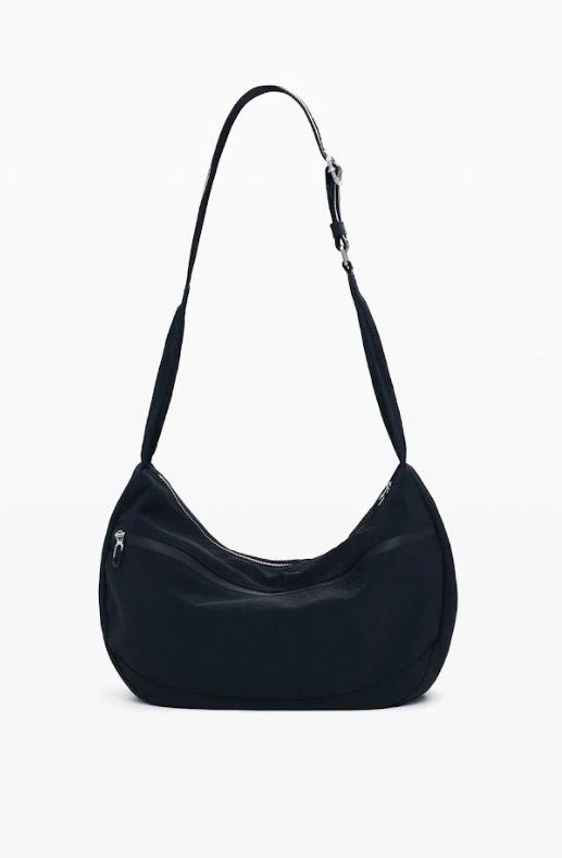 Black handbag on a white background