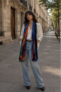 Woman wearing a colorful scarf on a city street