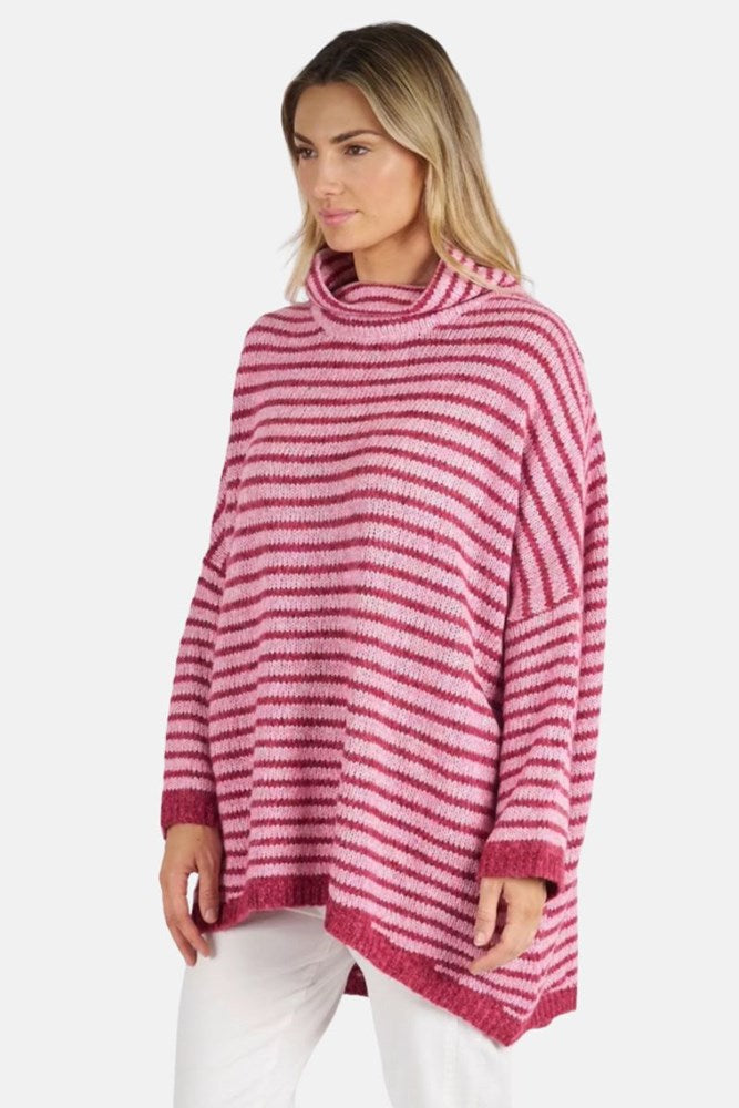 Woman wearing a pink and white striped sweater on a white background