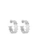 A pair of textured silver hoop earrings with small bead-like accents along the outer edge, shown on a plain white background.
