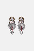 Pair of ornate earrings with intricate designs on a white background
